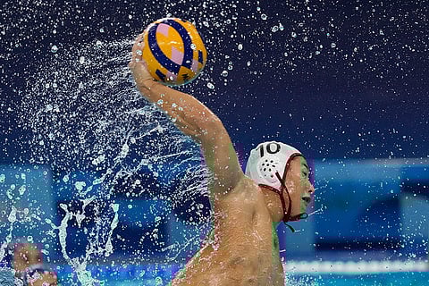 Yusuke Inaba makes an attempt to score during water polo match